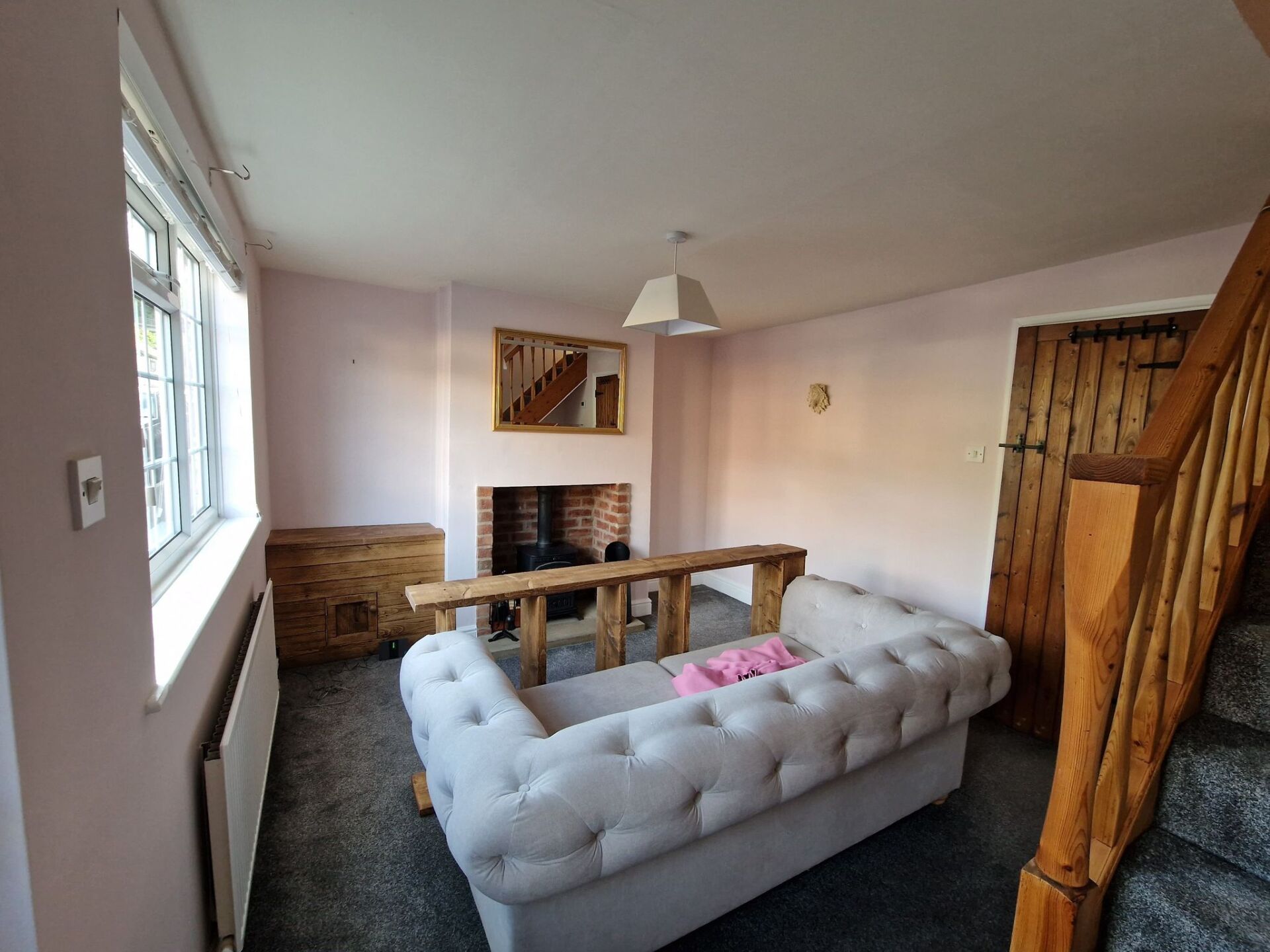 Painting, decorating, Ripley, Dollies Designs and Decorating, Ilkeston, Derbyshire. Livingroom done with chalk white ceiling and clay pink on the walls.