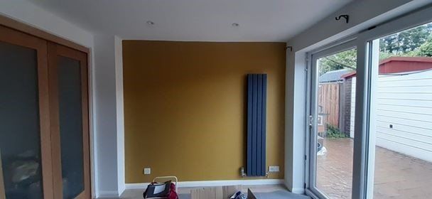 Painting and decorating, in Cotmanhay. Feature wall mustard yellow. Dollies Designs and Decorating, Ilkeston, Derbyshire.