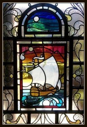 A galleon stained glass window incorporated into a victorian door