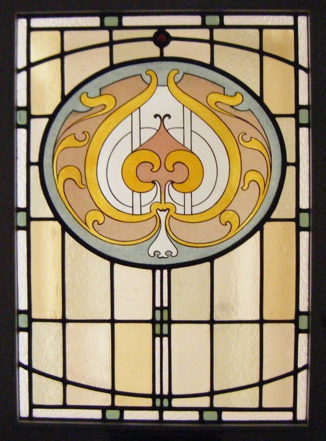 Art nouveau stained glass architectural salvage. Art Nouveau styled stained glass window resized and built into a new leaded glass door panel
