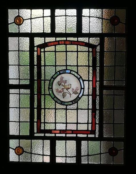 11 leaded glass panel front door panel with a painted roundel of a spug and apple blossom tree