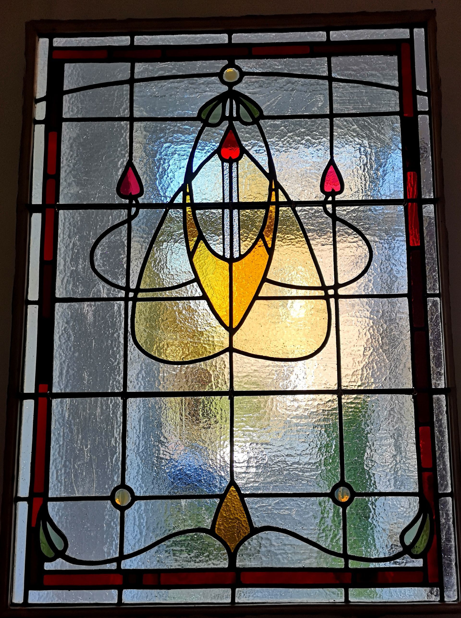 The central panel of a Glasgow Style stained glass window