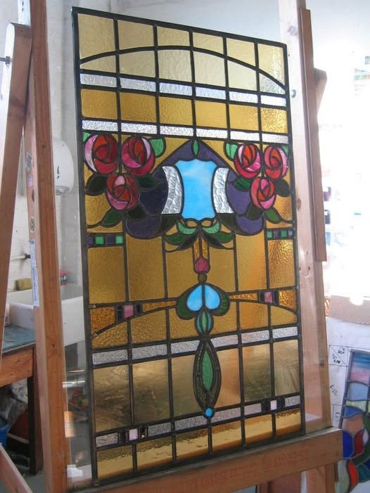 bright and colourfull leaded glass window depicting stylised roses extended for a new door