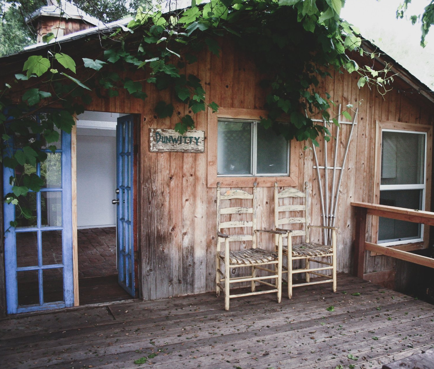 front deck with weathered dining chairs