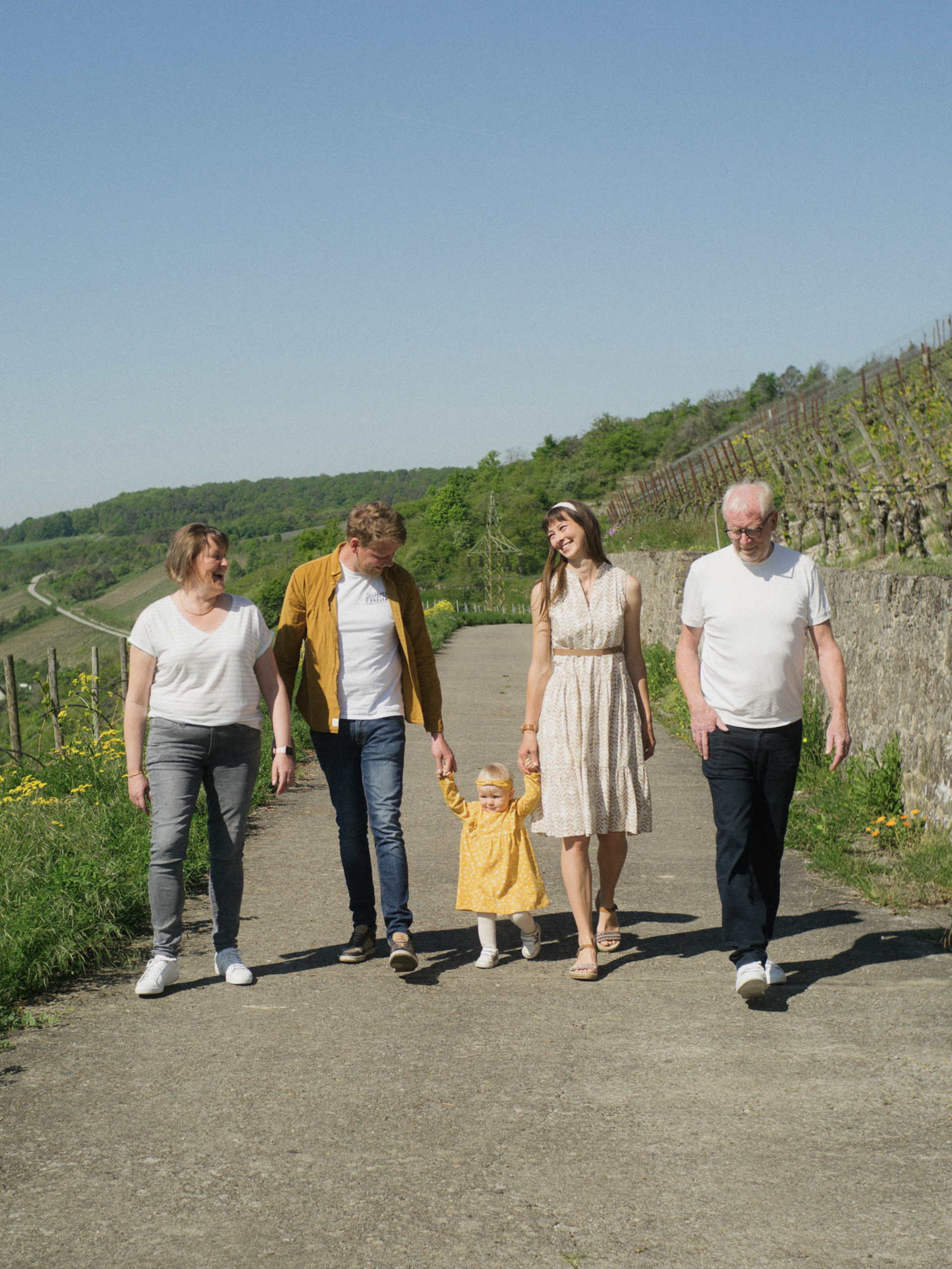 Family is walking in vineyard Weingut Rudolf May