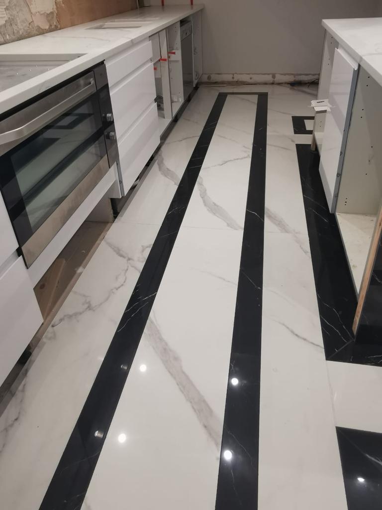 White and black patterned porcelain flooring.