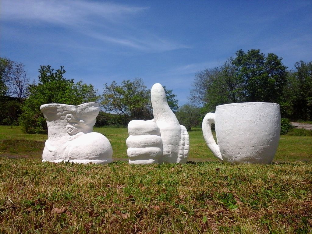 Decorations mix concrete garden decorations, boot, thumbs up and cup of coffee