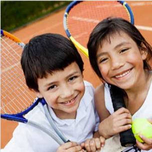 Image of 2 juniors holding racquets