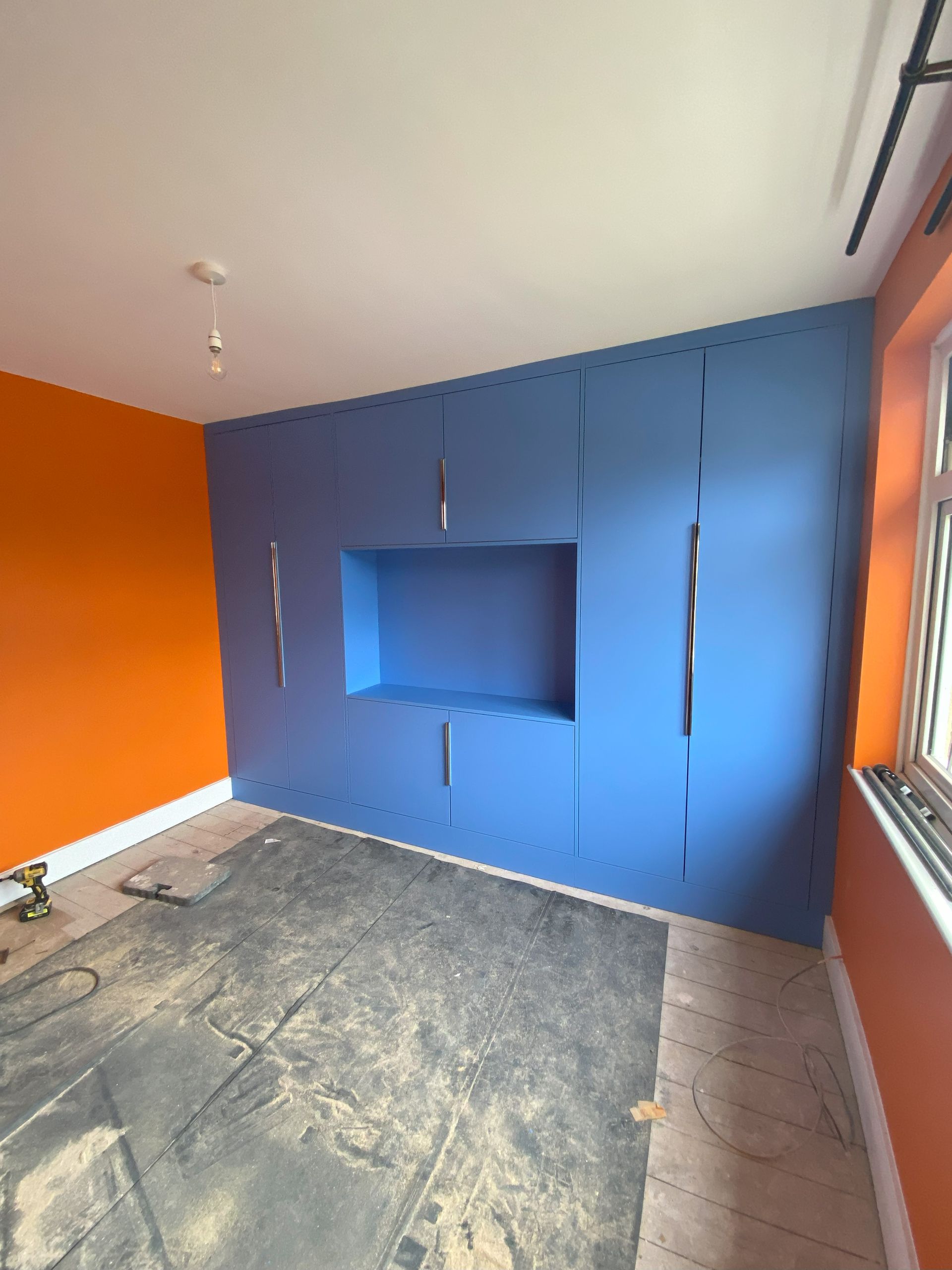 Bedroom joinery we installed in Molesey along with sleak profile handles. The cupboard is hand crafted and made for MFC egger boards.