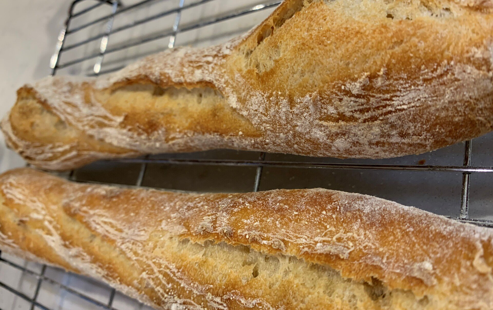 Warm, crusty sourdough baguette
