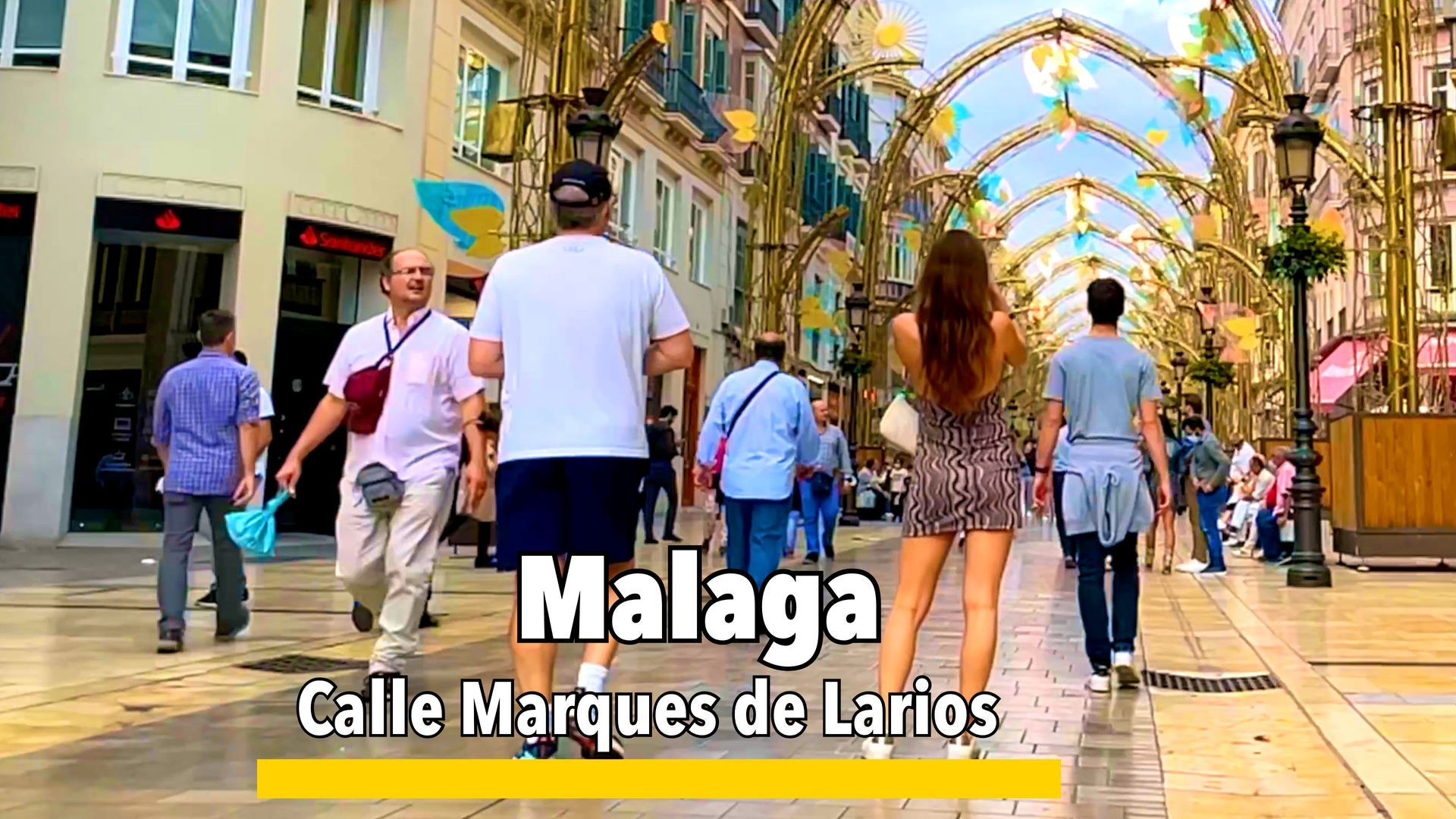 Calle Marqués de Larios in Málaga, a popular pedestrian street lined with shops, cafes, and historic architecture in the city center