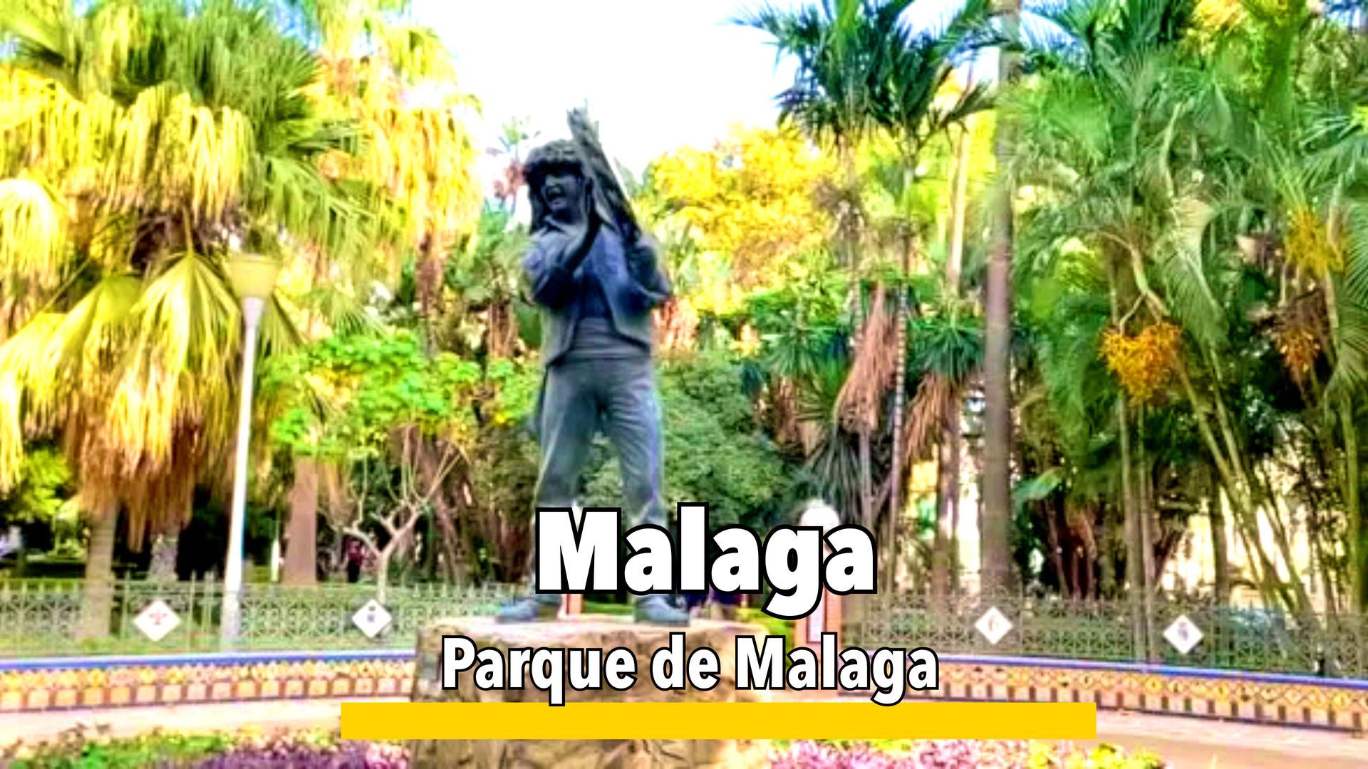 Parque de Málaga, a lush, tropical garden with palm trees, fountains, and walking paths, offering a peaceful escape in the city center