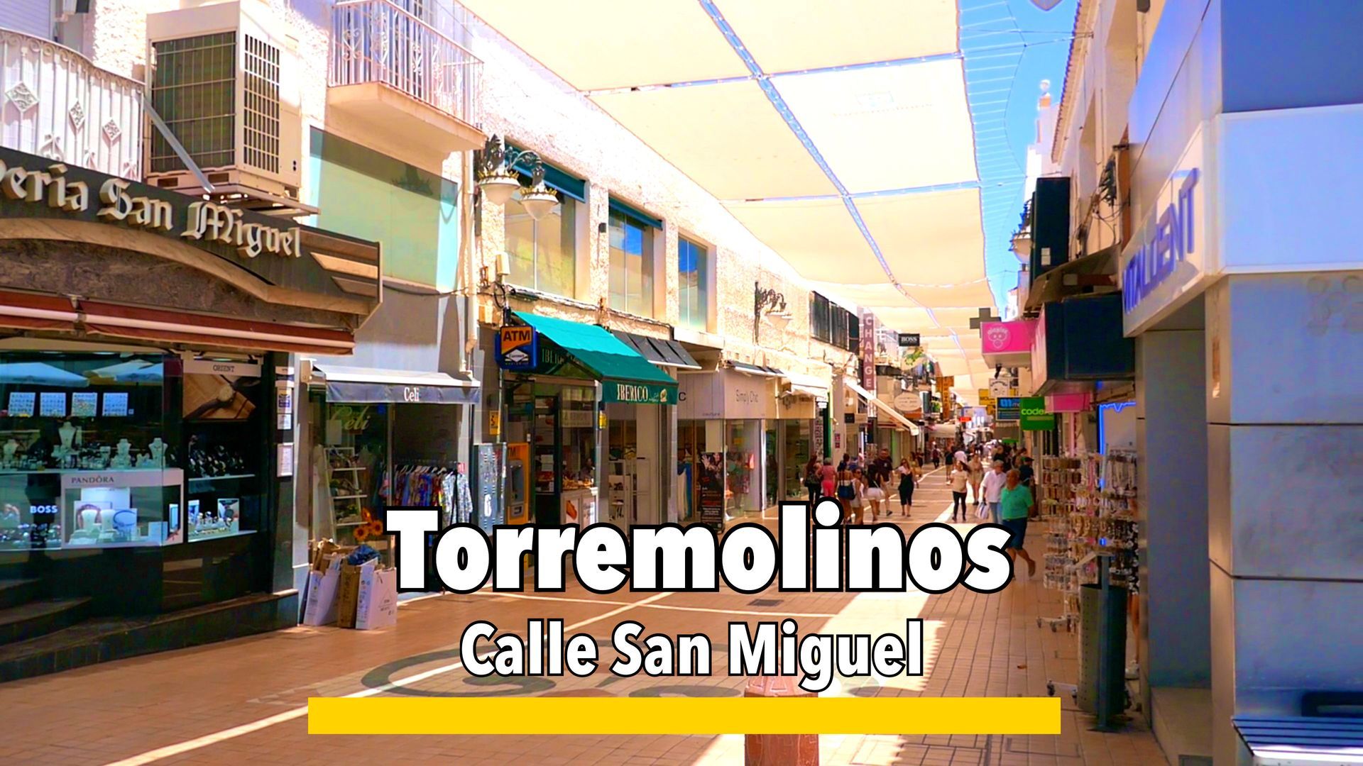 Calle San Miguel in Torremolinos, a bustling pedestrian street lined with shops, restaurants, and vibrant local culture