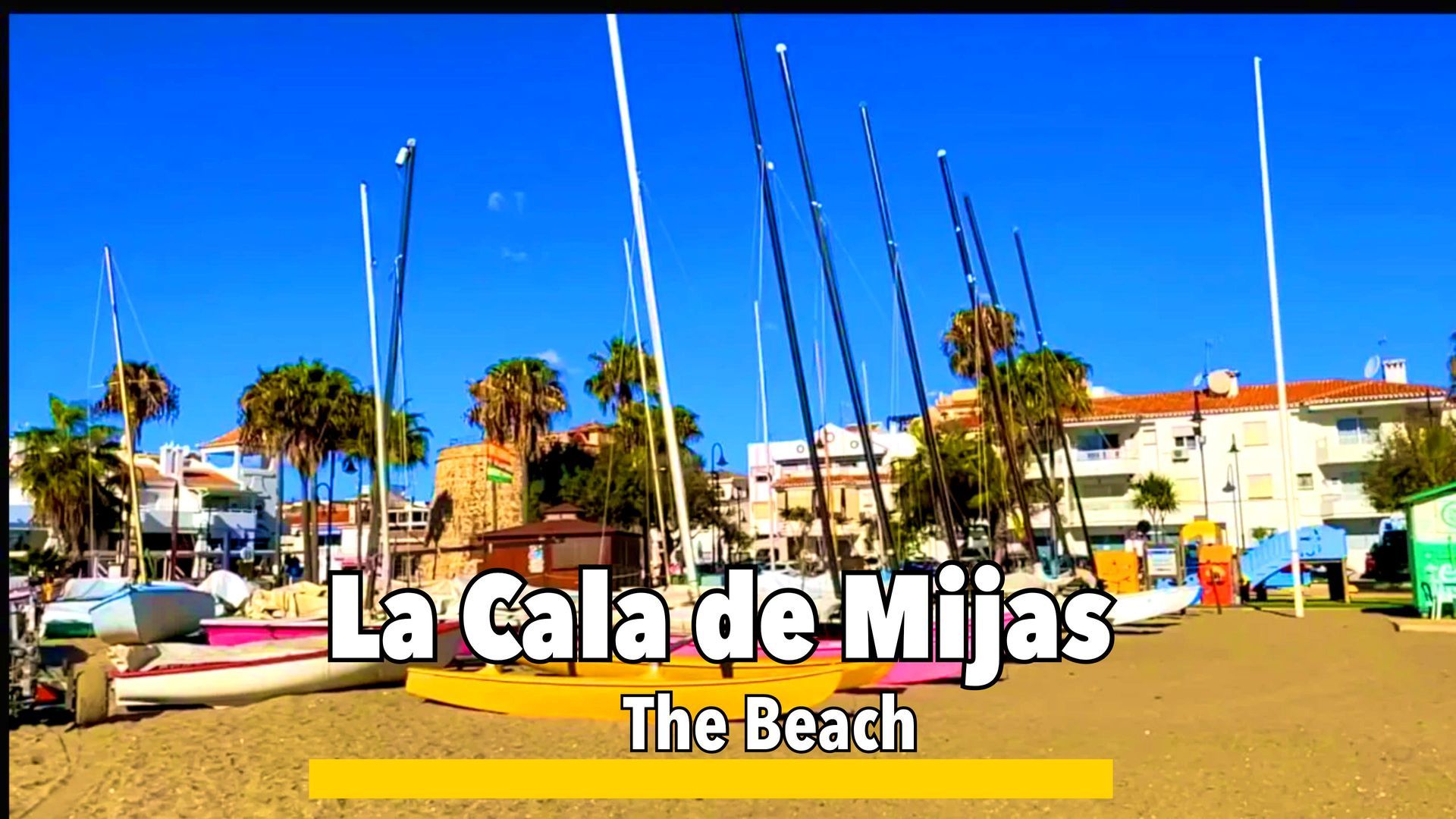 Beach and promenade with sandy shores, palm-lined walkways, and scenic sea views, offering relaxation and leisure activities.