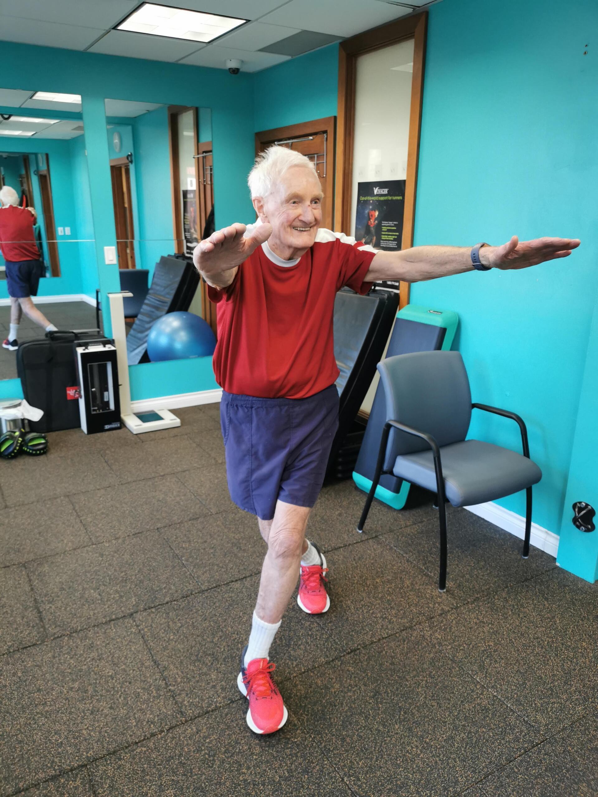 Barrie performing a great curtsy lunge! Male Senior Smiling Exercise