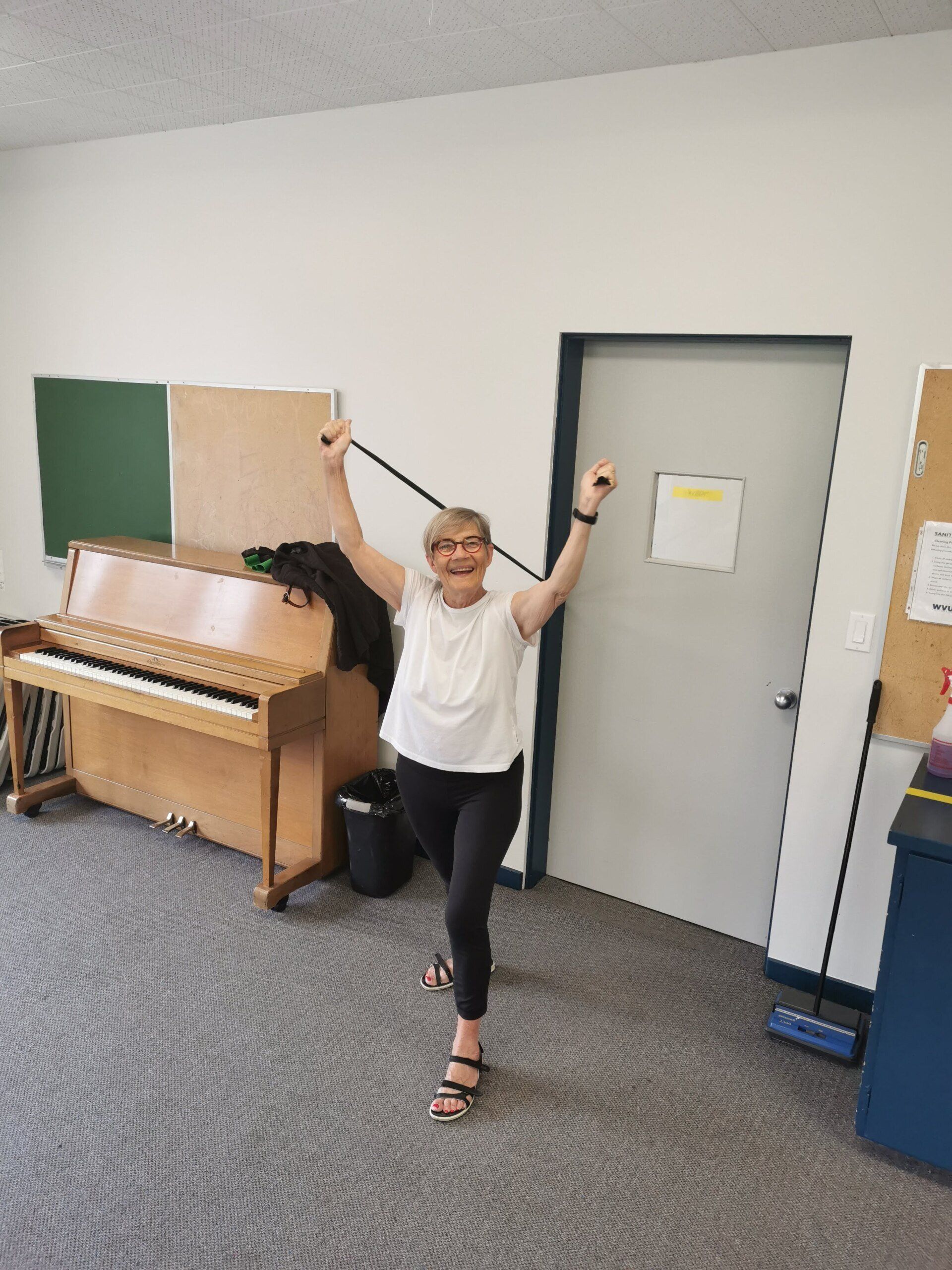 Freda is having fun! Senior group fitness class with bands