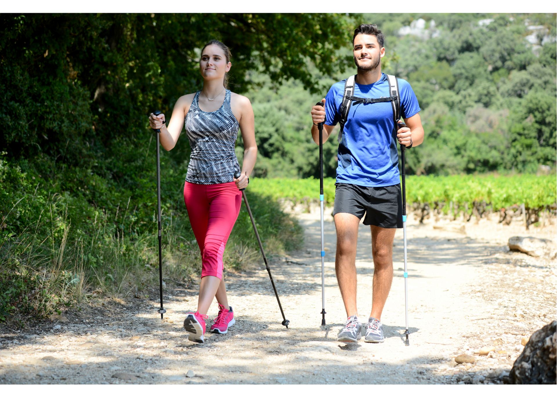 Couple hiking with walking sticks in nature