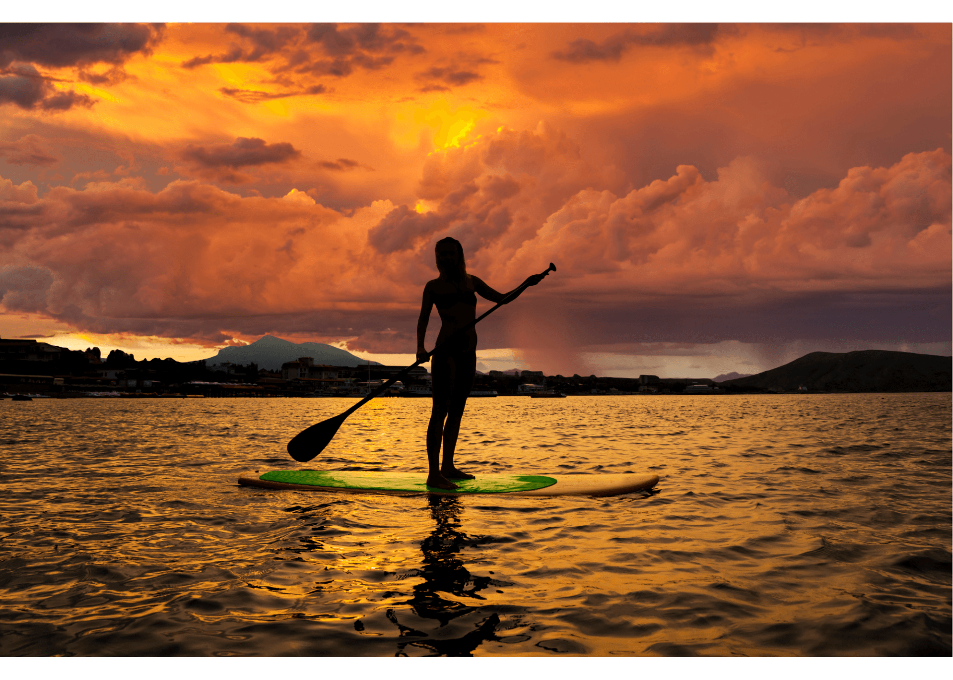 stand up paddle boarding at sunset