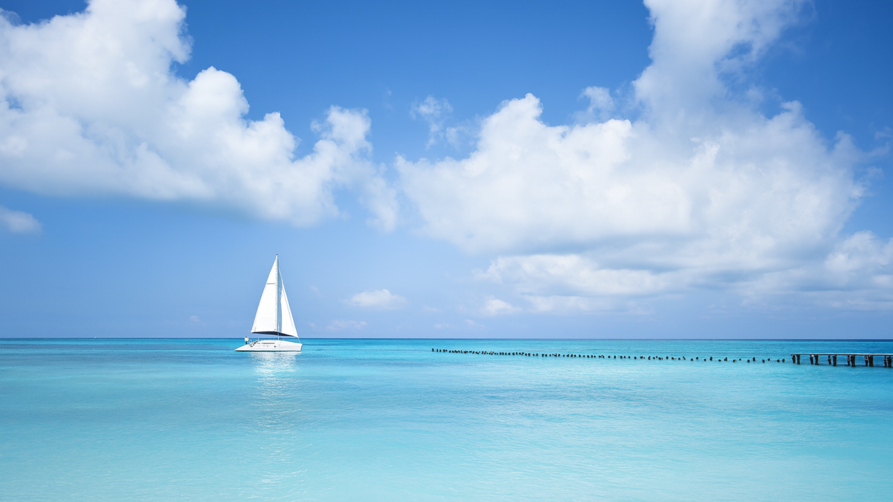 KI-generiertes Foto einer Segelyacht im türkisblauem Meer unter blauem Himmel
