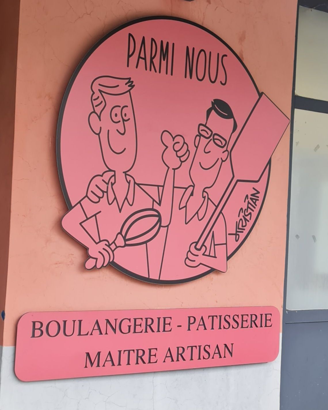 Boulangerie - rosa Schild am Eingang