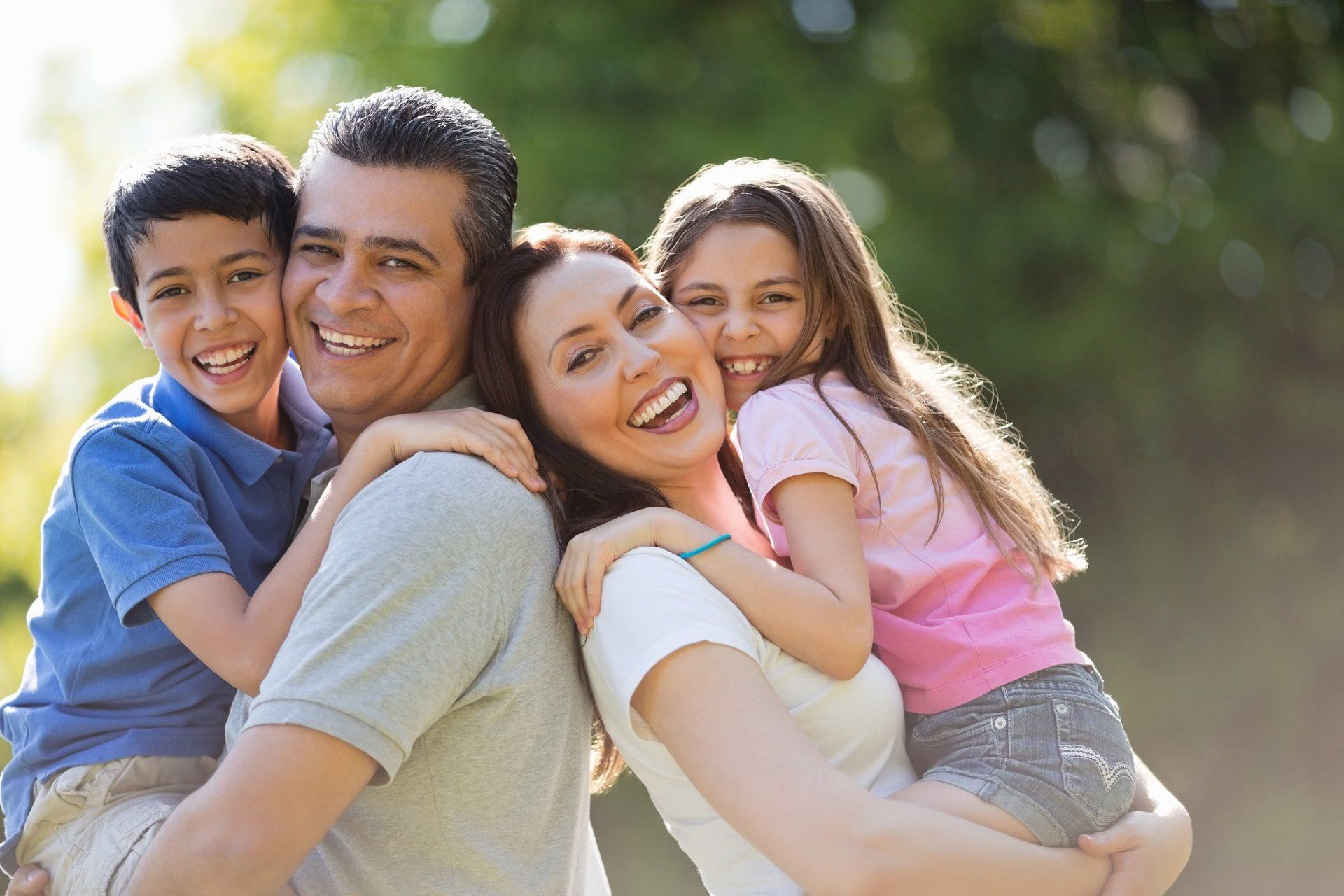 Happy Parents Holding Their Son and Daughter