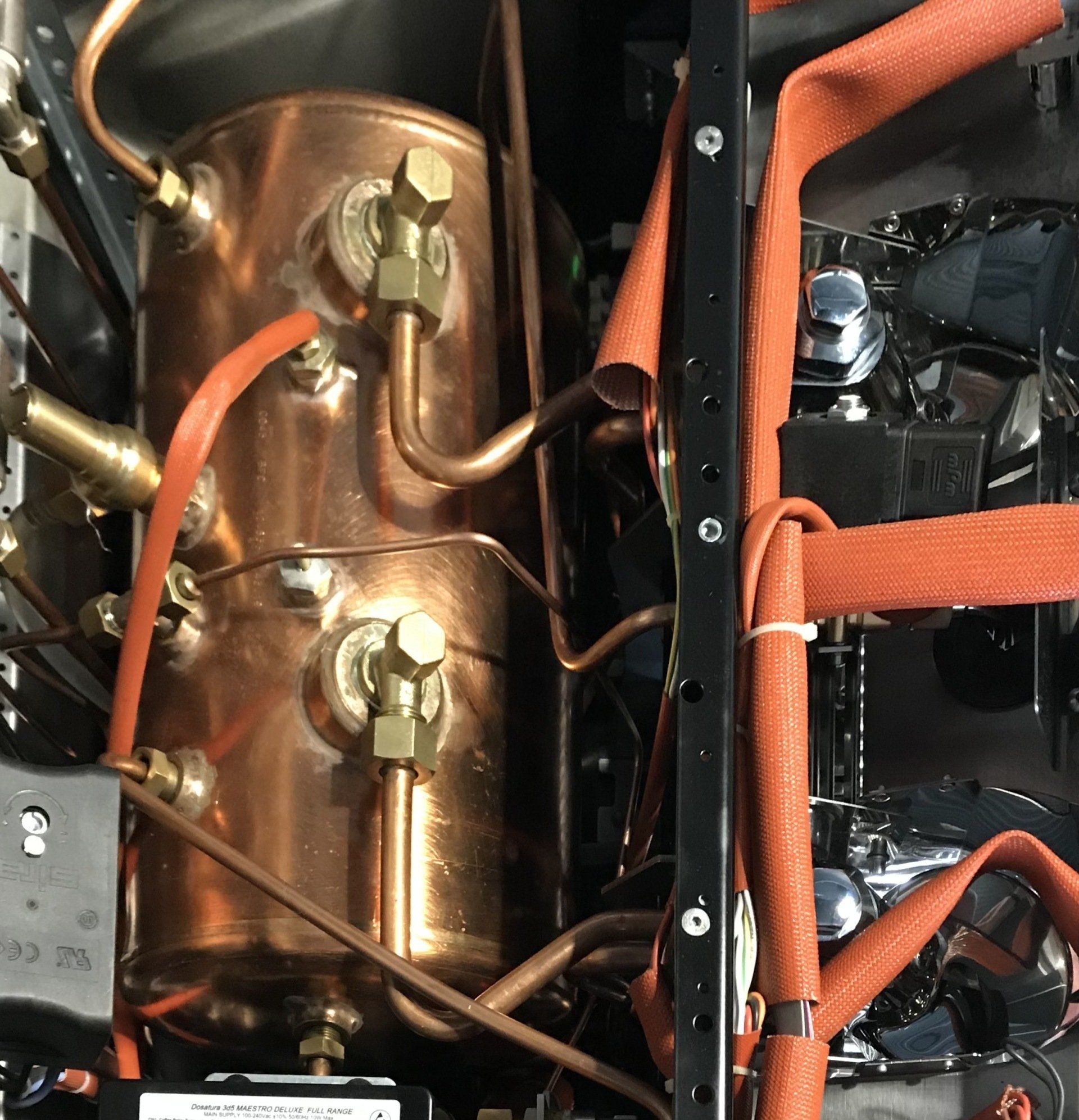 Image of the inside of an espresso machine under repair by Blue J Coffee. Professional servicing and repair