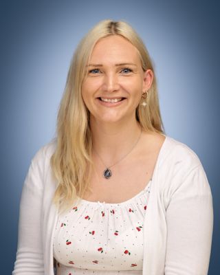 Head and shoulders of a woman with long blonde hair