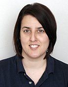 Head and shoulders of a woman with short dark hair