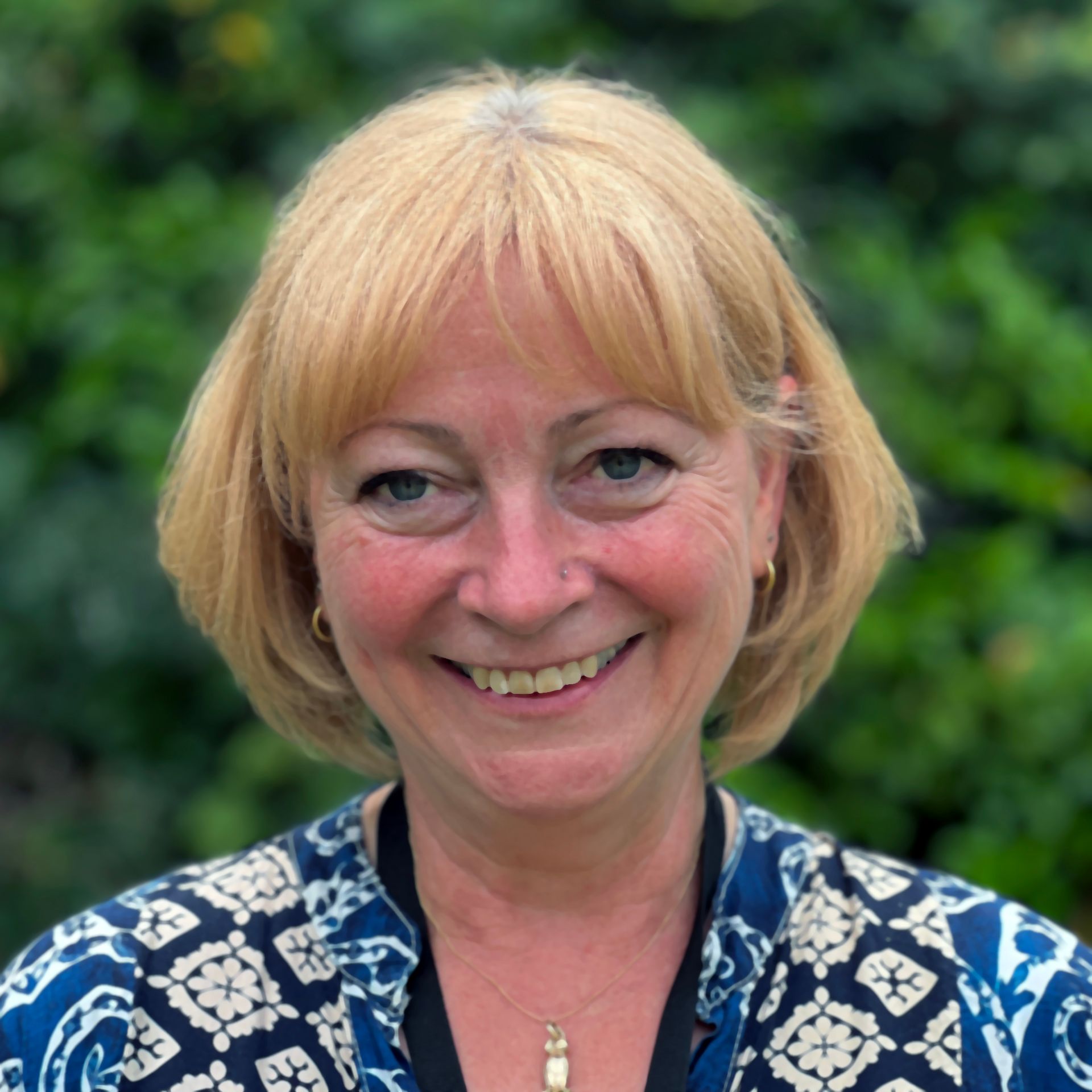 Head and shoulders of a woman with short blonde hair