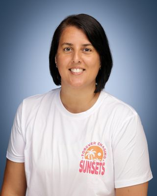 Head and shoulders of a woman with short dark hair