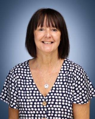 Head and shoulders of a woman with dark hair