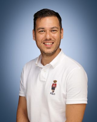 Head and shoulders of a man with dark hair