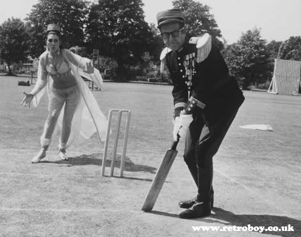 Howzat! Phil Silvers & Anita Harris relaxing with some cricket between takes on 'Carry On Follow That Camel' (1967).