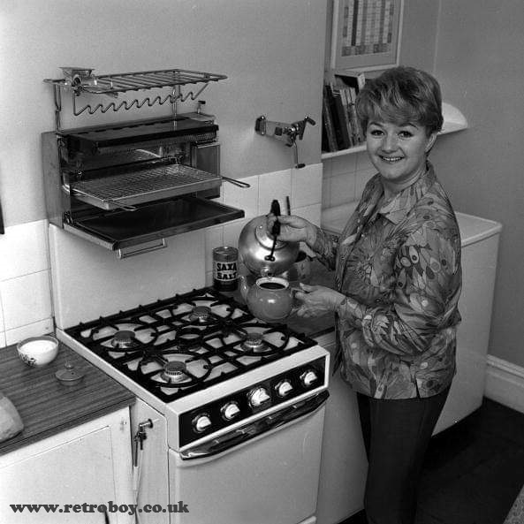 A rare shot of Joan Sims making a pot of tea at home (circa 1969).