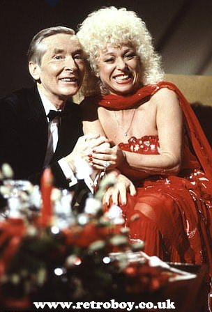 Kenneth Williams & Barbara Windsor in a publicity shot for 'Carry On Laughing's Christmas Classics' (1983).