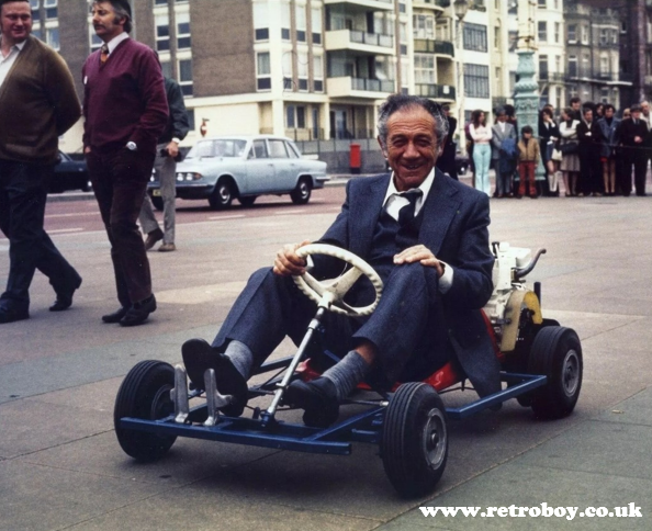 Sid James shows us his getaway vehicle in Brighton during the filming of 'Carry On Girls' (1973),