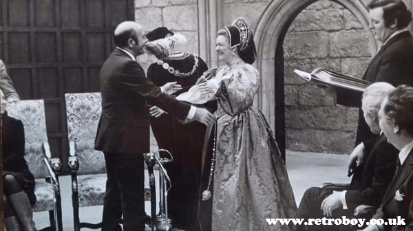 Talbot Rothwell greeting Joan Sims as one of the guests on his episode of 'This is Your Life' on the set of 'Carry On Henry' in 1970 - Joan is still in costume as Queen Marie!