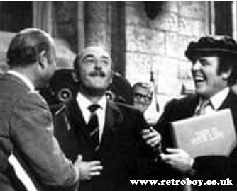 'Carry On' scriptwriter Talbot Rothwell is surprised with the 'big red book' for 'This is Your Life' on the set of 'Carry On Henry' (1970).