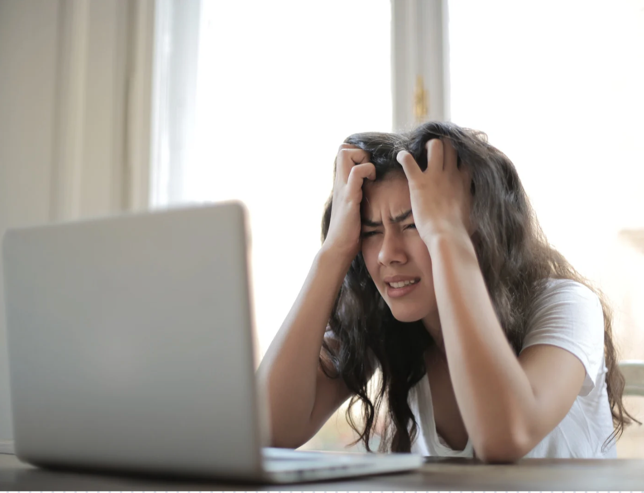 Stressed business owner at laptop