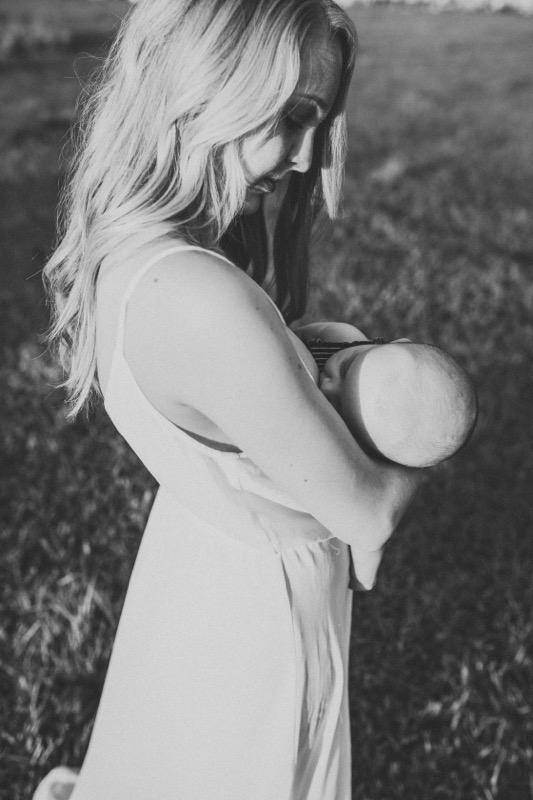 black and white photo of women breastfeeding