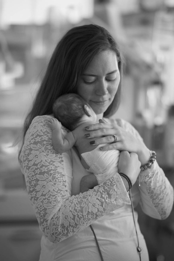 women holding newborn