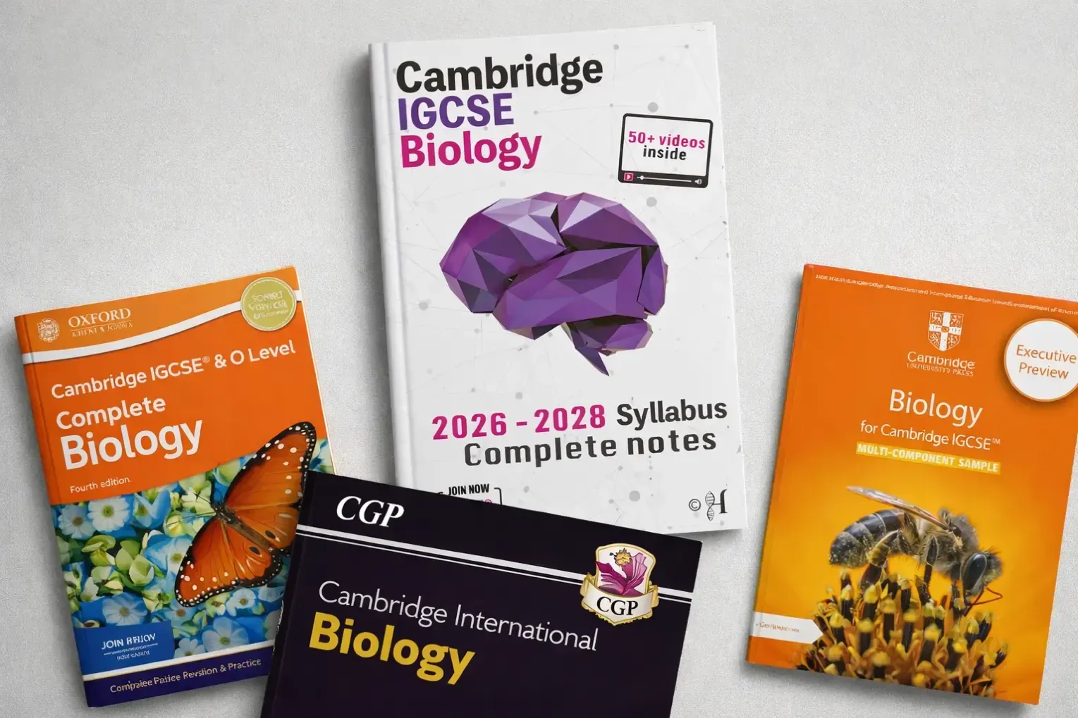 Cambridge IGCSE Biology complete notes book for the 2026–2028 syllabus displayed with other books