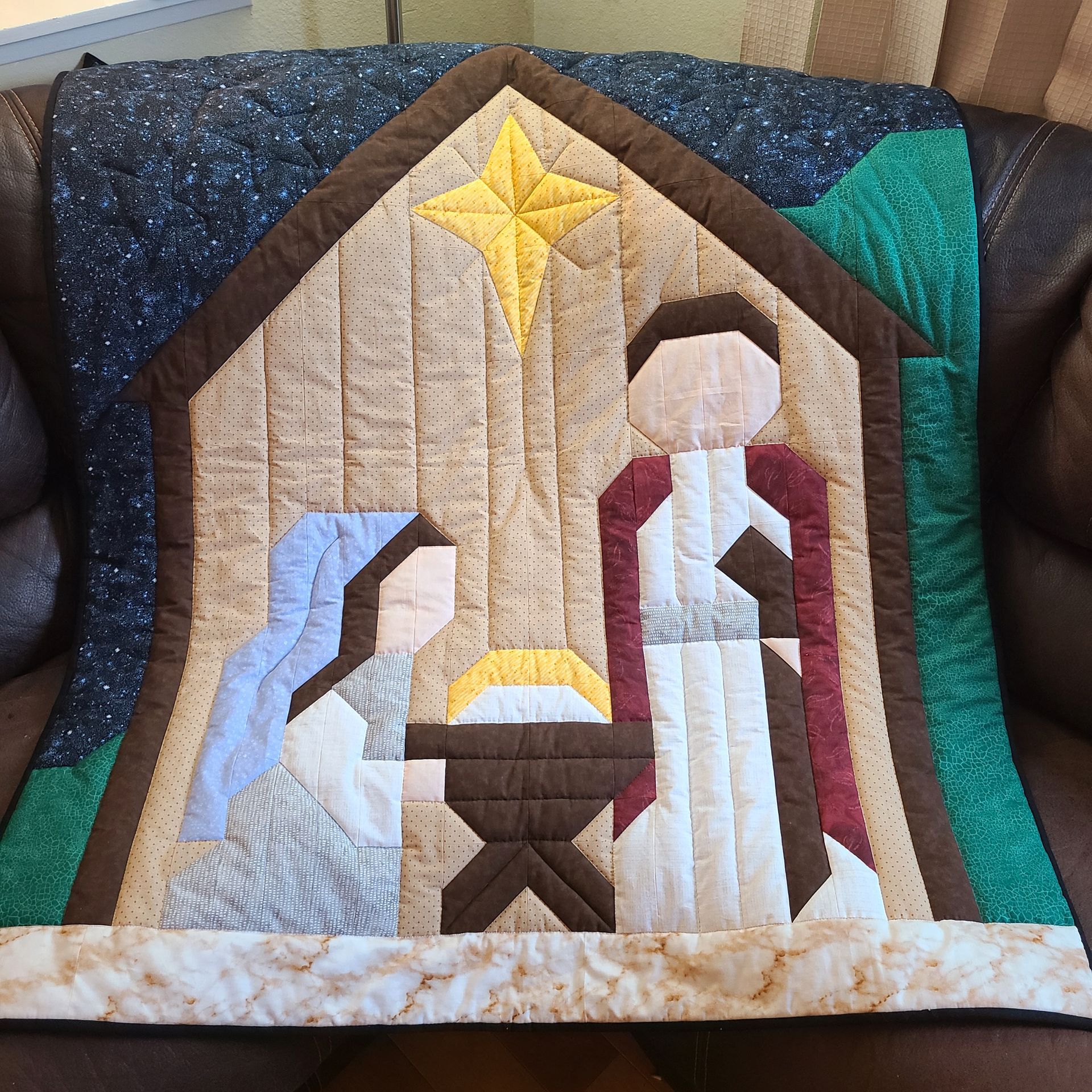 Nativity Quilt pattern on couch