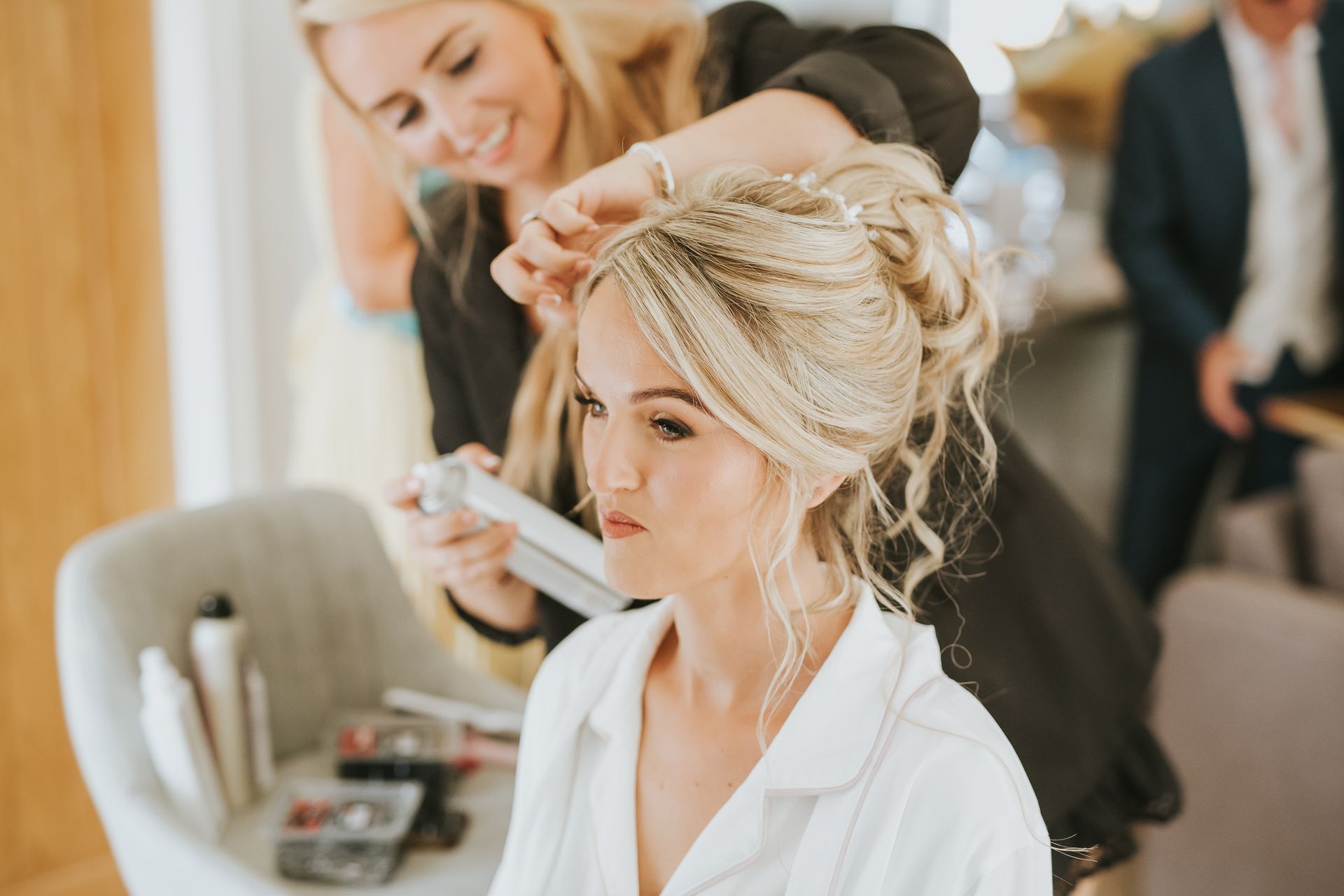 Bridal hair specialist styling a textured bridal updo on a wedding morning in Lincolnshire