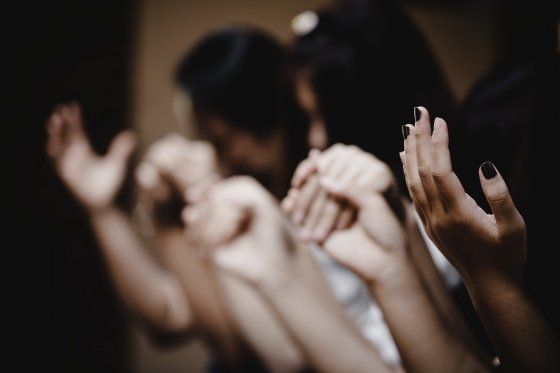 a group of people praying