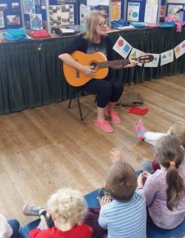 visitor playing guitar