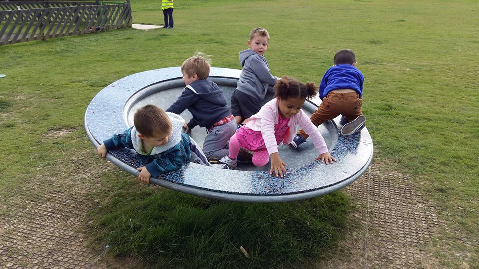 friends playing at the park