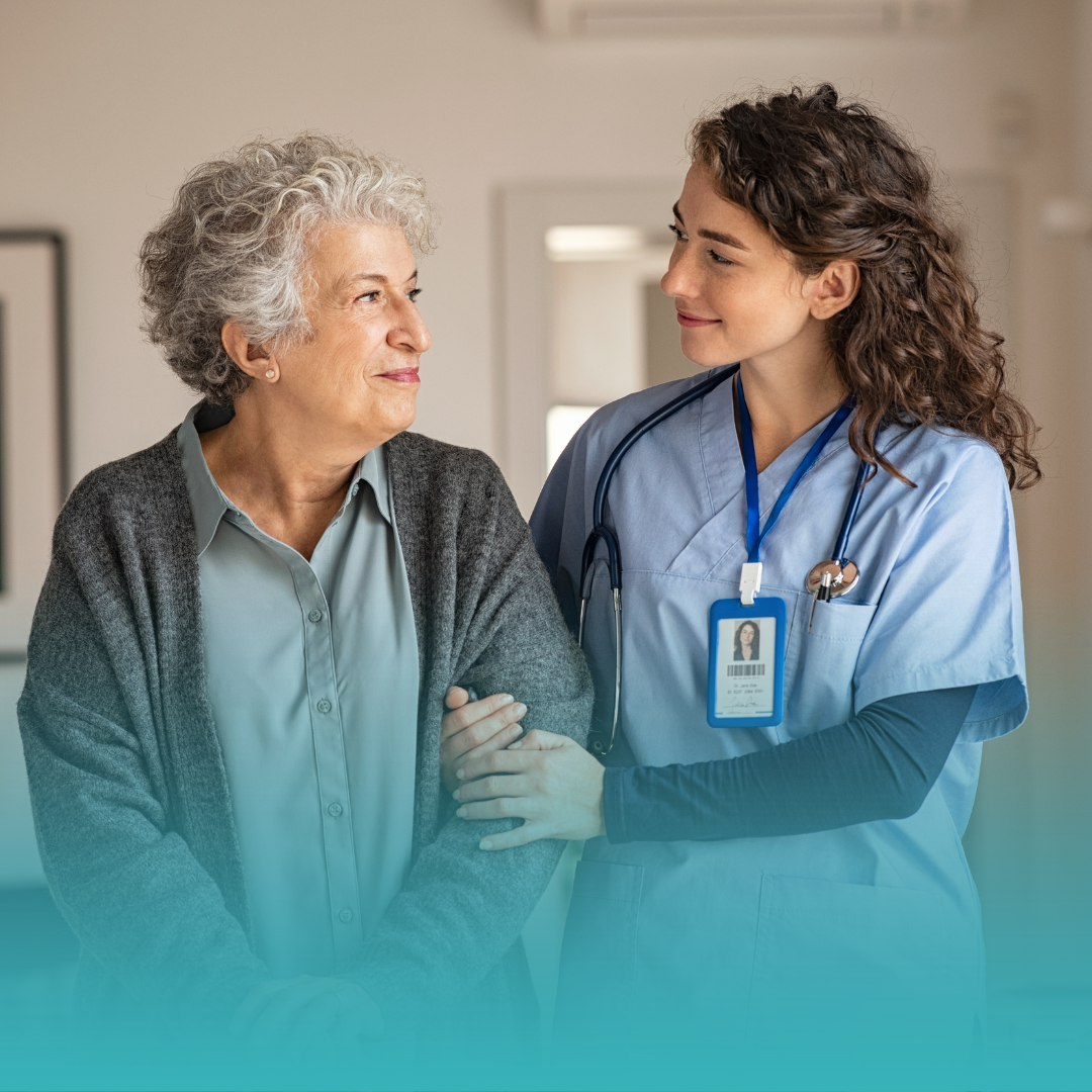 Our Services - A senior citizen and a healthcare provider looking at each other happily.