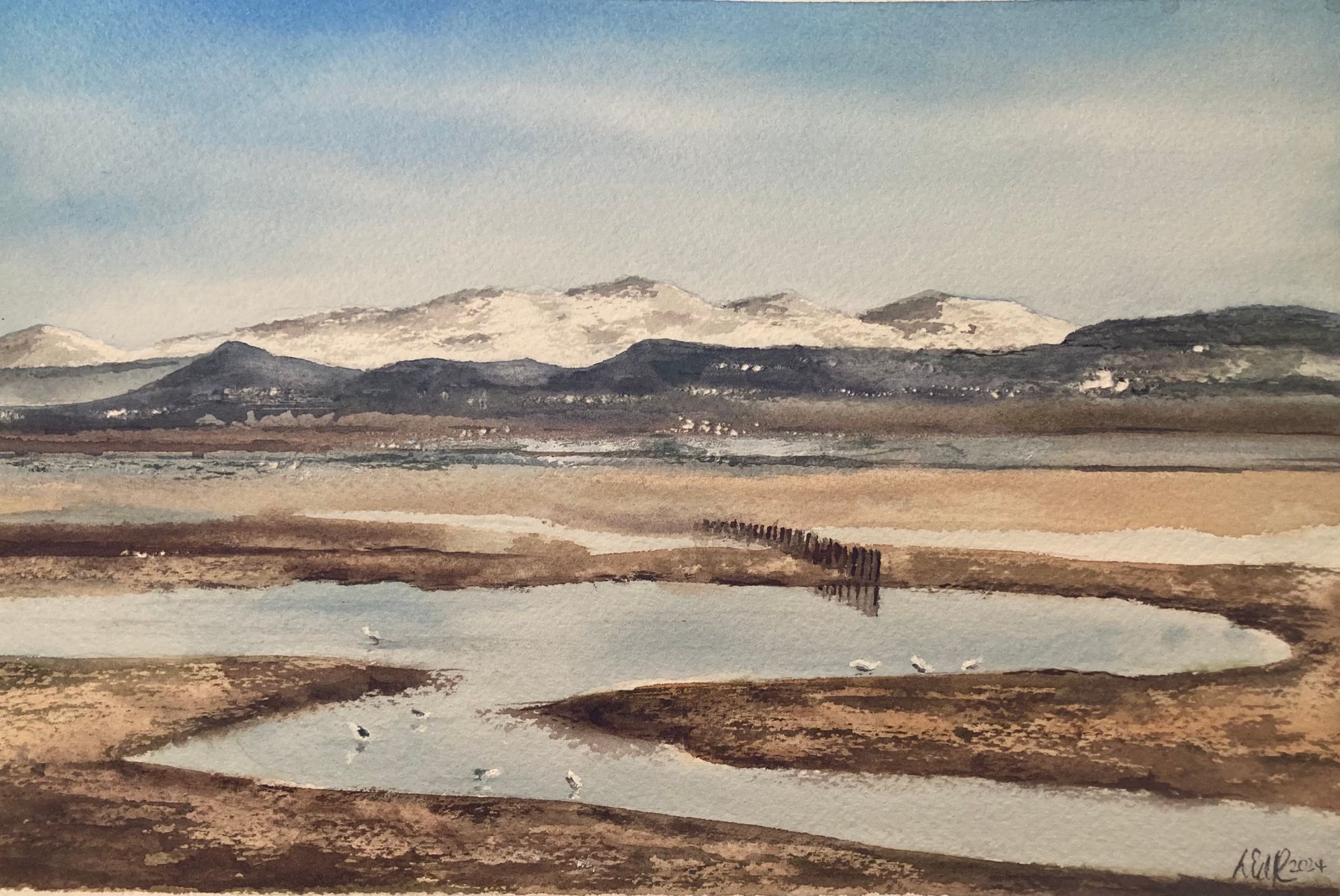 a watercolour painting of the view from morecambe looking over Morecambe bay to the lakeland hills. Watercolout painting of the snowcapped hills in the lake district