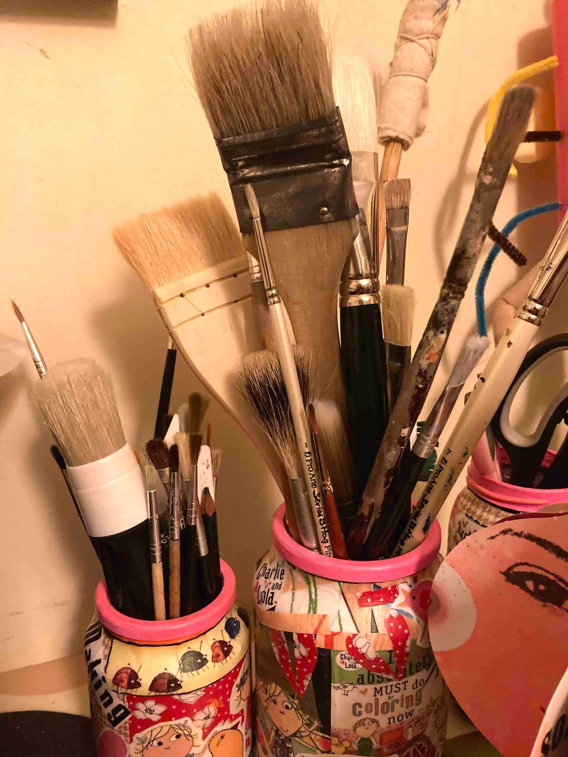 a selection of lidia ranns brushes for painting in her homemade charlie and lola jars